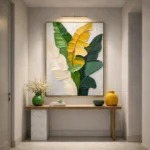 Contemporary hand-painted canvas featuring layered tropical leaves in vibrant yellow and green, textured palette, modern entryway