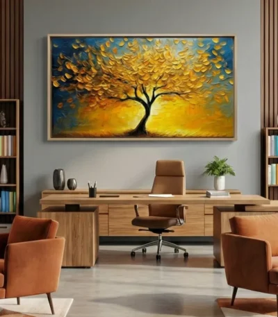 Textured hand-painted canvas depicting golden tree with layered leaf canopy against deep blue sky in warm ochre tones, contemporary office space