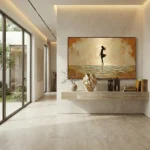 Figurative hand-painted canvas depicting silhouetted figure surfing golden waves under warm ochre sky, contemporary entryway