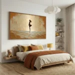 Textured hand-painted canvas depicting a silhouetted figure in golden ocean waves and warm earth tones, contemporary bedroom