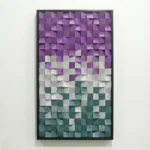 Textured abstract hand-painted canvas in purple, grey, and teal gradient with dimensional square patterns, white wall backdrop