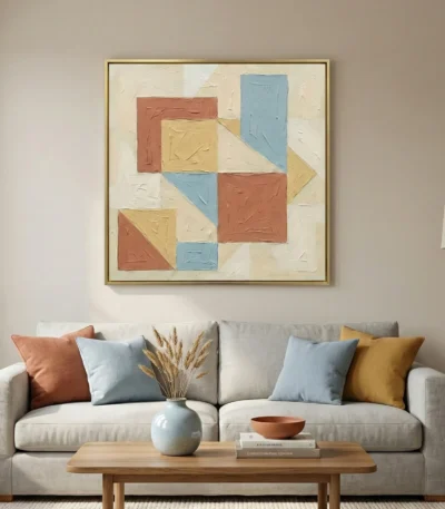Textured geometric hand-painted canvas in terracotta, soft blue and golden yellow with cream background, contemporary living space