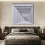 Minimalist hand-painted canvas depicting receding rectangular frames in monochrome grays and whites, contemporary bedroom