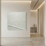 Textured minimalist seascape hand-painted canvas in monochromatic white and cream tones, contemporary gallery space