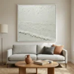 Textured abstract seascape painting with layered white brushstrokes depicting ocean waves and horizon, contemporary living space