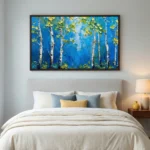 Textured landscape hand-painted canvas depicting white birch trees with golden foliage against deep blue brushstrokes, modern bedroom