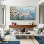 Painterly hand-painted canvas depicting cascading white and blush blossoms against soft blue sky with delicate brushwork, contemporary living space