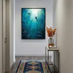 Atmospheric hand-painted canvas depicting two scuba divers ascending toward sunlight through deep ocean blues and turquoise tones, contemporary entryway