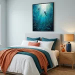 Contemporary figurative hand-painted canvas depicting two divers ascending toward sunlit water in deep teal and aquamarine tones, modern bedroom