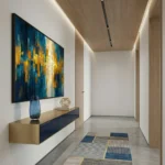 Contemporary abstract hand-painted canvas in deep blues and golden yellows with layered geometric blocks, modern entryway