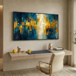Layered abstract hand-painted canvas in deep teals, golden yellows, and cream with intersecting geometric forms, contemporary workspace