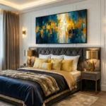 Abstract expressionist hand-painted canvas in layered blues, golds and creams with gestural brushwork, modern bedroom setting