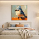 Gestural contemporary painting of a perched bird in blue, cream and burnt orange brushstrokes, hand-painted canvas in modern bedroom