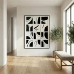 Minimalist abstract hand-painted canvas with geometric black shapes and curved lines on cream, contemporary entryway