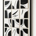 Twelve Arcs textured wall art shown framed on the wall in a styled interior