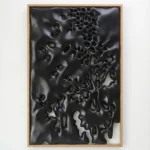 Textured abstract hand-painted canvas with layered black organic forms and negative space, monochromatic palette, contemporary interior