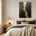 Textured abstract hand-painted canvas with bold gold leaf river dividing charcoal and black tones, modern bedroom