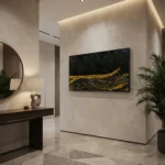 Textured abstract hand-painted canvas in black and gold with dynamic layered brushstrokes, contemporary entryway