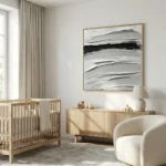 Gestural abstract hand-painted canvas with layered monochromatic brushstrokes in charcoal and cream, nursery setting