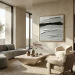Gestural abstract hand-painted canvas with layered horizontal brushstrokes in charcoal, ivory, and silver tones, contemporary living space