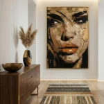 Gestural expressionist hand-painted canvas depicting female portrait in ochre, black and cream tones, contemporary entryway