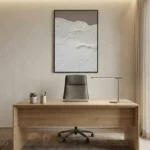 Textured monochrome hand-painted canvas depicting layered snow-covered mountains in white and grey, modern office space
