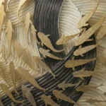 Contemporary textured wall art featuring layered fish silhouettes in gold and charcoal tones, hand-painted canvas
