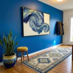 Gestural abstract expressionist hand-painted canvas in swirling cobalt and cream brushstrokes, contemporary entryway