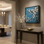 Contemporary hand-painted canvas depicting cascading white blossoms against deep teal background, modern entryway