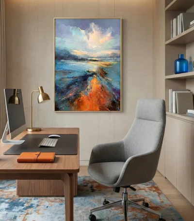 Textured abstract landscape hand-painted canvas in vibrant blues, oranges, and golds with gestural brushstrokes, contemporary office setting