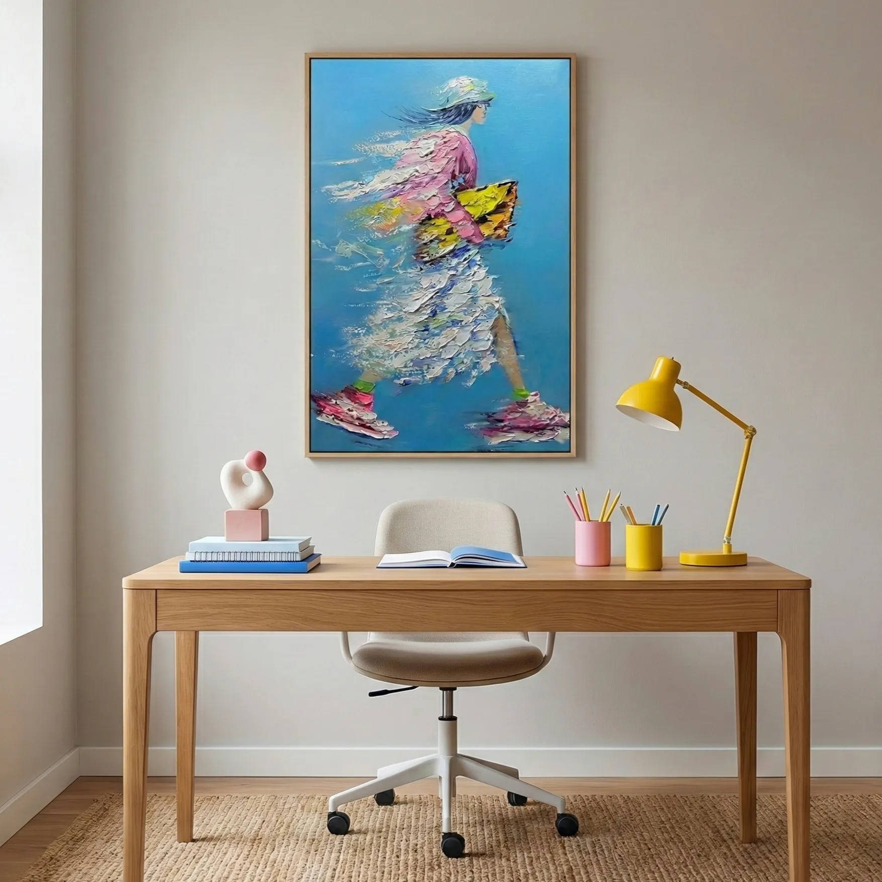 Chasing Stories – Contemporary Abstract Motion Painting (5) Contemporary figurative hand-painted canvas depicting a woman composed of layered fish and marine life in vibrant pink, yellow, and blue tones, styled workspace
