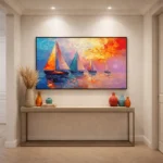 Impressionist hand-painted canvas depicting sailboats at sunset in vivid orange, blue, and pink brushstrokes, contemporary entryway