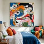 Gestural abstract expressionist hand-painted canvas with fragmented faces in vibrant blue, orange, red and black, modern bedroom setting