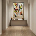Gestural abstract hand-painted canvas in vibrant reds, blues, and lime greens with dynamic brushstrokes, modern entryway