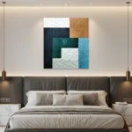 Layered abstract hand-painted canvas in navy, teal, cream and ochre with textured diagonal patterns, contemporary bedroom
