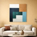 Layered abstract hand-painted canvas in deep navy, forest green, warm terracotta and cool blue with textured geometric composition, contemporary living space