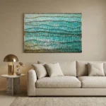 Layered abstract hand-painted canvas with undulating wave patterns in turquoise, teal and ochre tones, contemporary living space