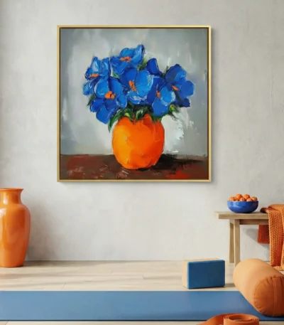Contemporary still life hand-painted canvas featuring vibrant blue flowers in bold orange vase, warm color palette