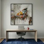 Gestural abstract hand-painted canvas of a colorful grand piano in vibrant yellows, reds and blues against textured grey, contemporary workspace