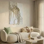 Textured abstract hand-painted canvas with layered cream and ivory tones featuring organic sculptural forms, contemporary living space
