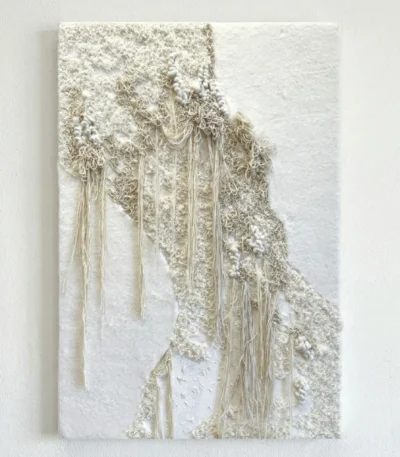Textured abstract hand-painted canvas with layered cream and ivory fibers, dangling strands, and dimensional beading, contemporary wall space