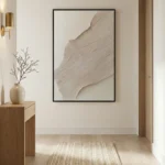Minimalist abstract hand-painted canvas with layered curved forms in soft taupe and cream tones, contemporary entryway