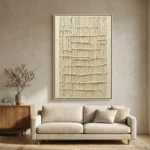 Textured abstract hand-painted canvas with layered cream and ivory brushstrokes creating dimensional relief, contemporary living space