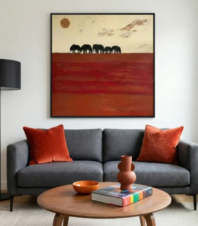 Minimalist hand-painted canvas depicting silhouetted elephants crossing terracotta plains beneath a golden sun, contemporary living space