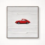 Minimalist hand-painted canvas featuring a red vintage car against textured white brushstrokes, contemporary living space