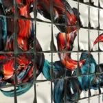 Gestural abstract hand-painted canvas with dynamic red and teal brushstrokes, displayed as modular grid wall art