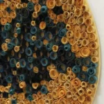 Textured abstract hand-painted canvas in layered teal, gold, and black concentric circles, contemporary wall art