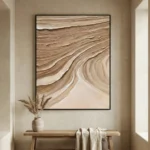 Textured abstract hand-painted canvas with flowing organic waves in warm sand and cream tones, contemporary entryway