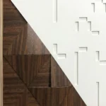 Textured geometric hand-painted canvas in rich walnut brown and cream with radiating sunburst pattern, contemporary space