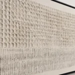 Ledger Lines textured wall art shown framed on the wall in a styled interior